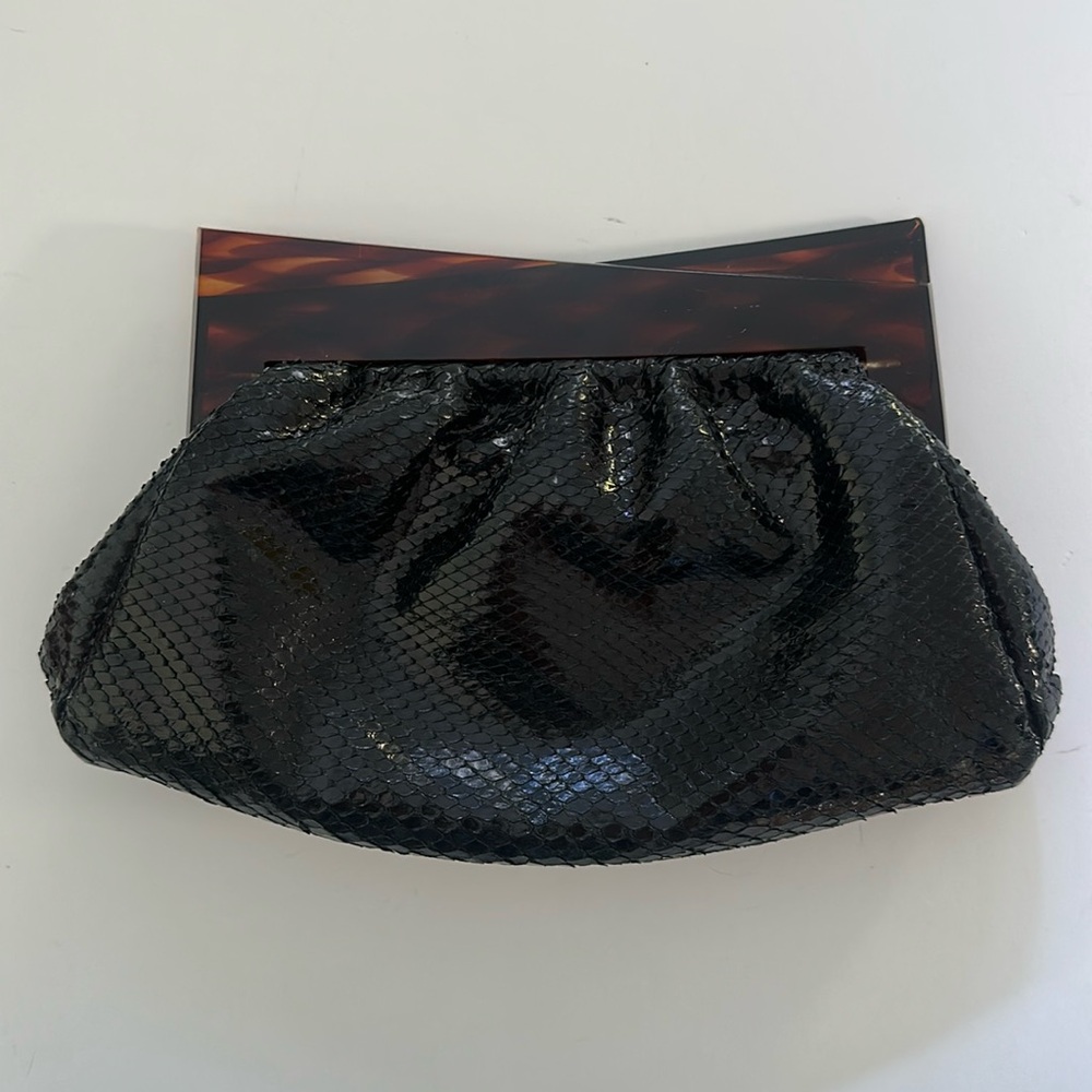 Vintage black clutch with brown lucite opening.
